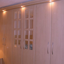 fitted wardrobes wood grain and mirrored door
