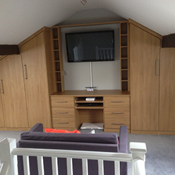 fitted wardrobe and TV area
