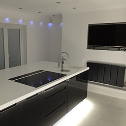 modern kitchen with white counter and black gloss finish