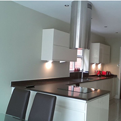 modern kitchen with black counter and white gloss finish